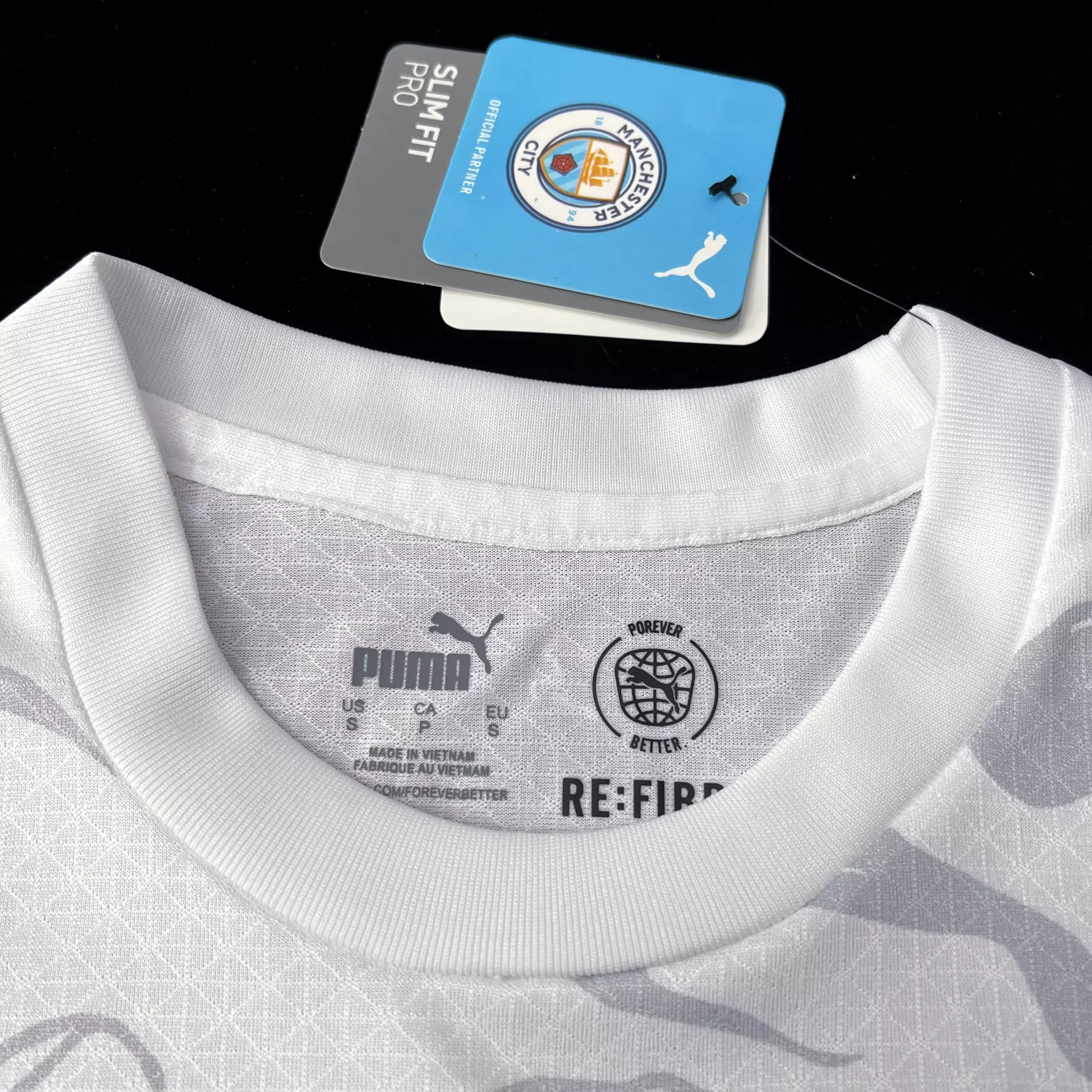 Camisa Manchester City Branca Dragão de Madeira 2024/25 Jogador Camisa Manchester City Branca Dragão de Madeira 2024/25 Jogador