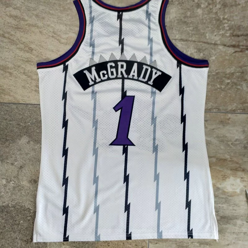 Regata NBA Mitchell & Ness Raptors 1998/99 Retro Macgrady #1 Regata NBA Mitchell & Ness Raptors 1998/99 Retro Macgrady #1