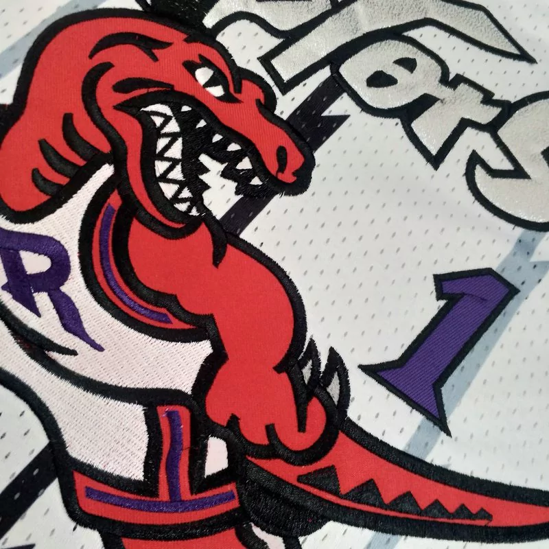 Regata NBA Mitchell & Ness Raptors 1998/99 Retro Macgrady #1 Regata NBA Mitchell & Ness Raptors 1998/99 Retro Macgrady #1