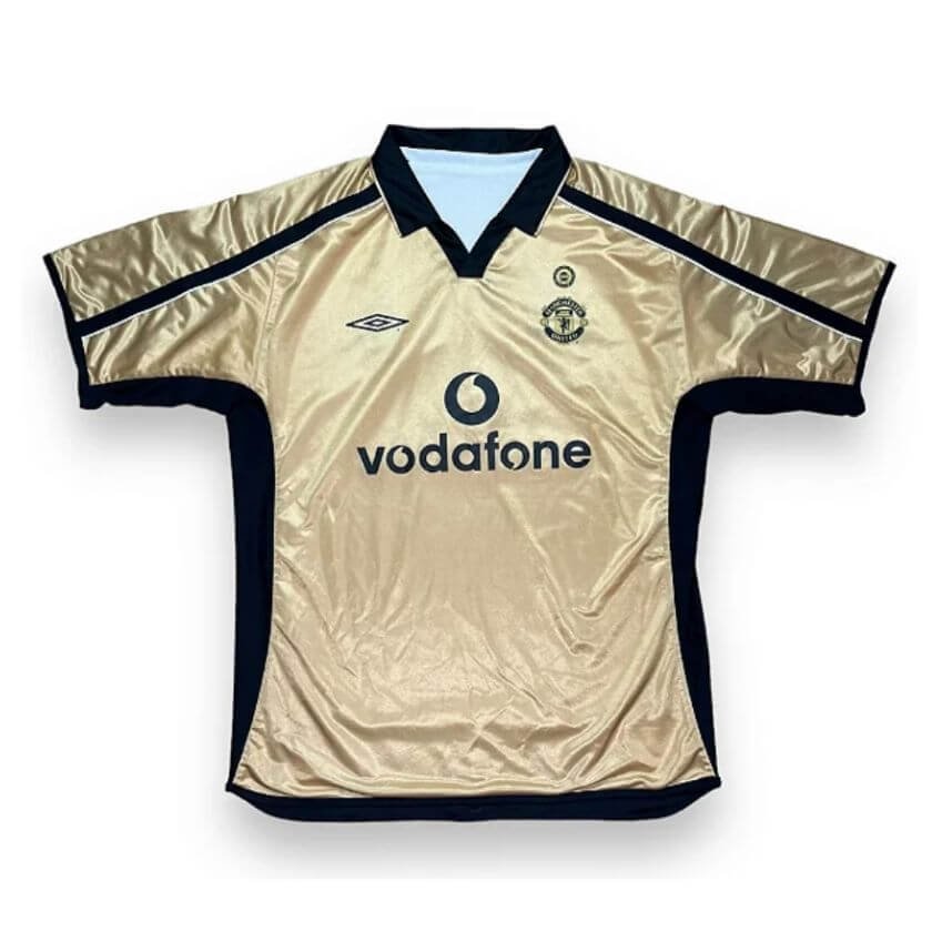 Camisa Man Utd Reversível Dourada/Branca Retrô 2001 100 Anos Camisa Man Utd Reversível Dourada/Branca Retrô 2001 100 Anos