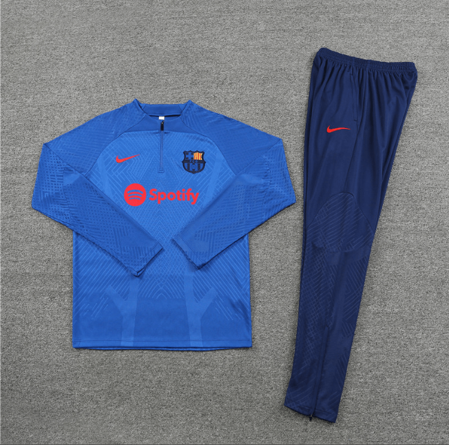 Conjunto-de-treino-barcelona-azul-escura-ii-2022-23-jaqueta-calca-jogador-loja-malta-esportes (1) Conjunto Barcelona Treino Jaqueta/Calça Azul Escura II Jogador 2022/23