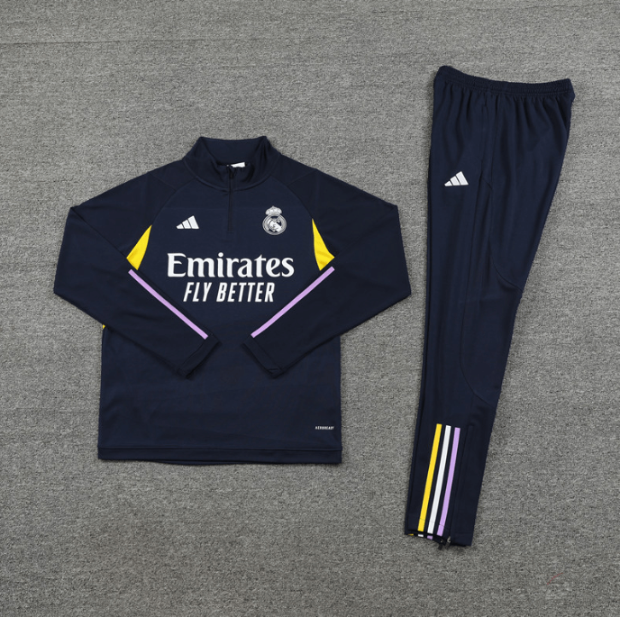 conjunto-treino-real-madrid-todo-azul-escuro-2024-25-calca-jaqueta (1) Conjunto de Treino Real Madrid Todo Azul 2022/23 Jaqueta e Calça